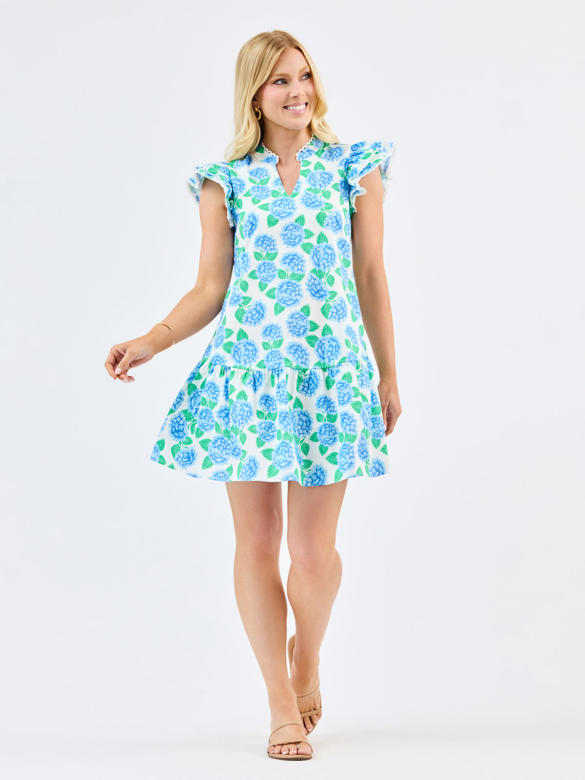 Woman wearing a floral dress on a white background